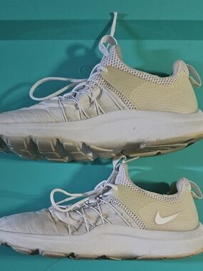 Nike Darwin sneakers in crisp triple white. 
Women’s Size 9.5.